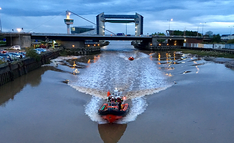 A boat on the River Hull in front of the Tidal Barrier